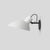 Vv cinquanta wall lamp design by vittoriano viganò this version is with white lacquered reflector and black mount. the vv...