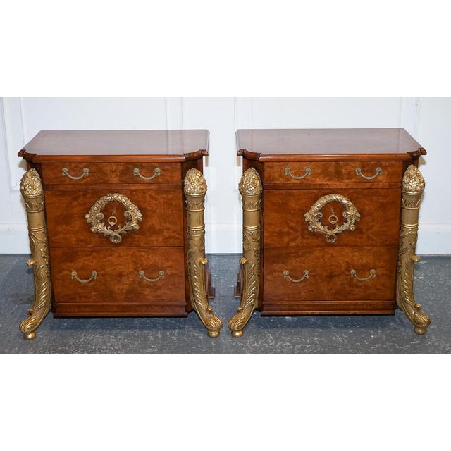 Stunning Pair Of French Empire-style bedside Nightstands. They exude opulence and sophistication. Crafted from beautiful...