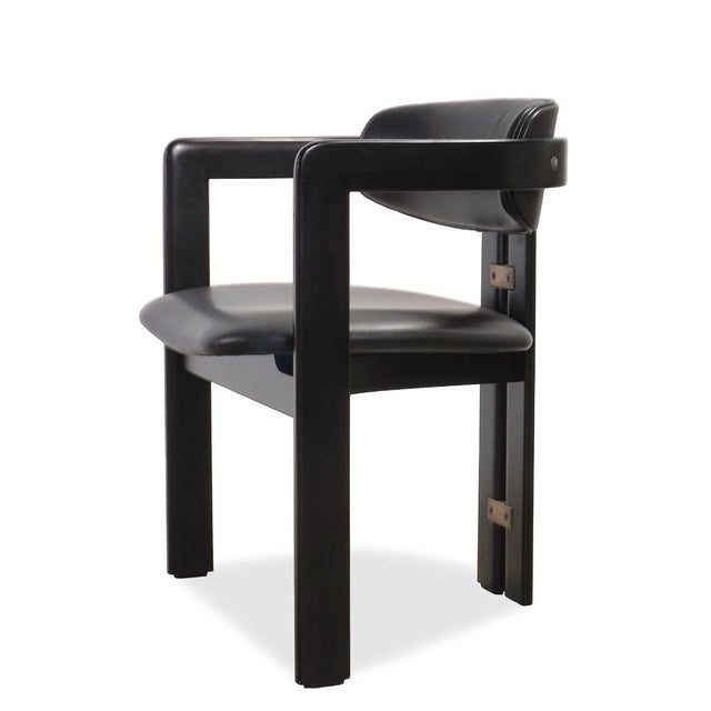 The Pamplona Dining Chair by Augusto Savini for Pozzi is a masterclass in restrained Italian modernism, where sculptural...