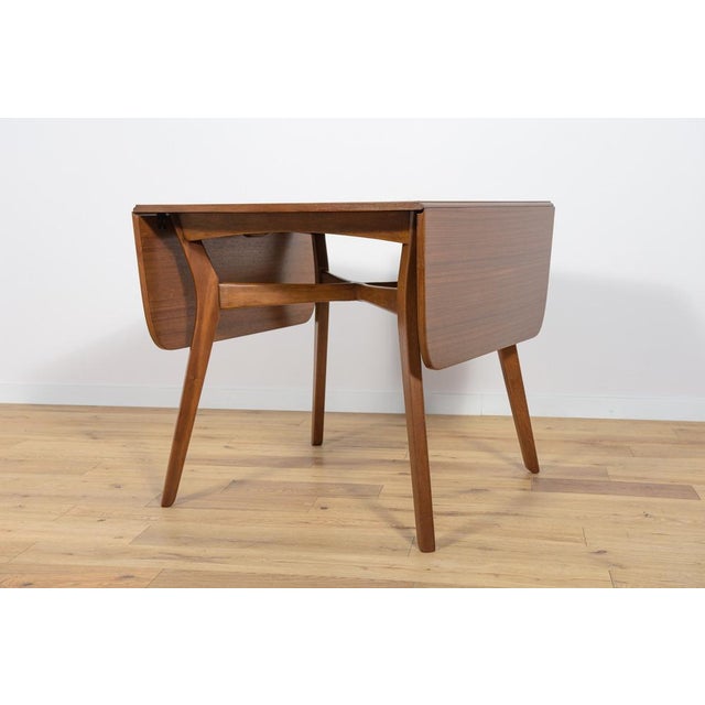 This British extendable dining table in teak was produced in the 1960s by G-Plan. Its wood elements have been cleaned from...