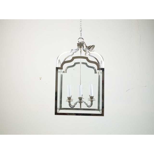 A vintage French nickel six-light lantern from the mid 20th century, with shaped glass panels. Created in France during...