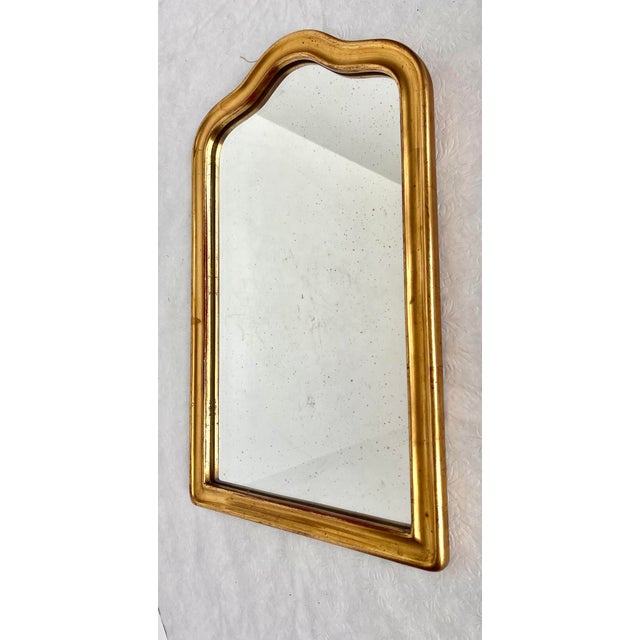 Imported from France. Antique gold frame mirror. Classic simple design to complement any decor. Gold over red finish with...