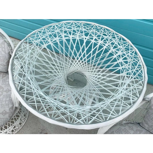 Spun fiberglass Russell Woodard indoor/outdoor dining set. Gorgeous table stands on 4 feet under the pedestal base. Table...