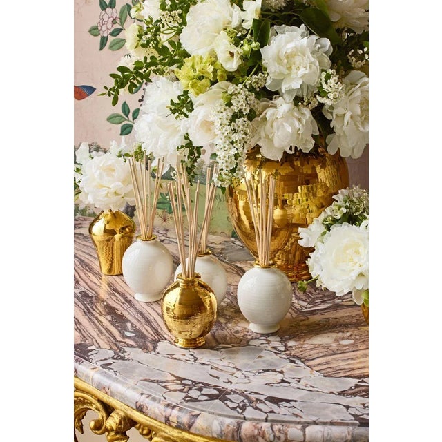 The Siena diffuser set features a spherical ceramic vessel enhanced with the potters handmade ribbing, providing an...