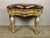 Custom serpentine shaped bench made with antique Italian painted and parcel gilt fluted legs with capital feet. The bench...