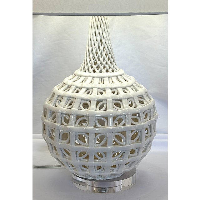 Truly unique Blanc de Chine reticulated porcelain lamp from the 20th century. The piece is made of white porcelain in a...