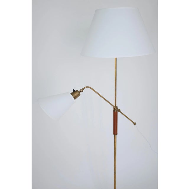 Impressive two armed brass and wood floor lamp by Bertil Brisborg for Nordiska Kompaniet. Manufactured in the 1950's where...