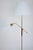 Impressive two armed brass and wood floor lamp by Bertil Brisborg for Nordiska Kompaniet. Manufactured in the 1950's where...