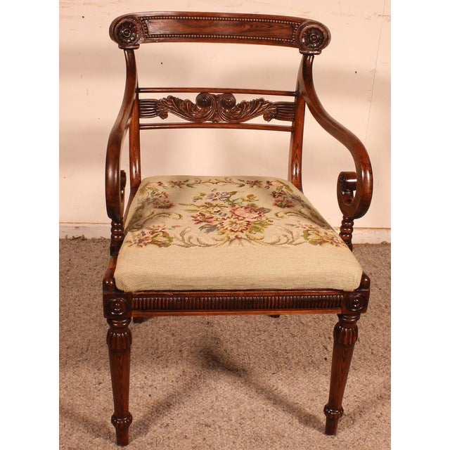 Lovely rosewood armchair from the beginning of the 19th century Regency period Very beautiful base decorated with a...