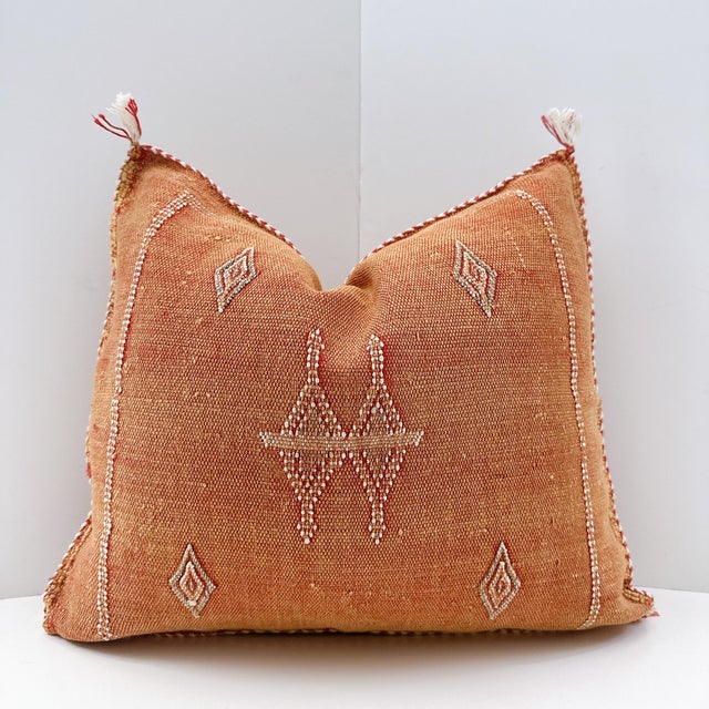 A handwoven, one-of-a-kind, Moroccan pillow made from cactus silk, vegetable silk, or Sabra silk. The silks are naturally...