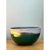 This vintage studio pottery bowl has a deep, rounded, hemispherical form that rises from a small, slightly recessed foot...