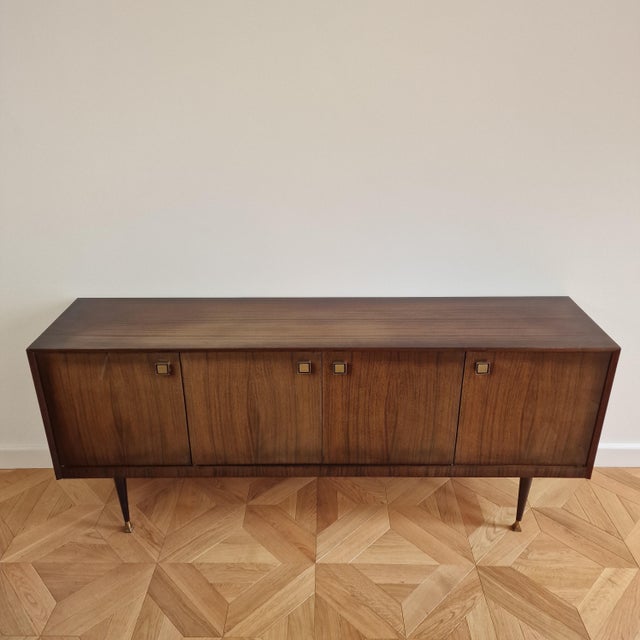 This exceptional mid-century modern credenza, expertly crafted in Italy during the 1960s, beautifully embodies the...