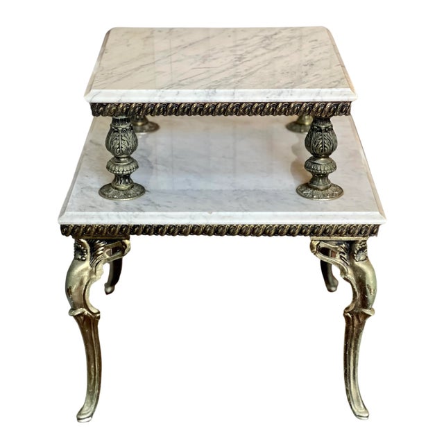 Carrera marble and gilded brass two tier side table, France circa 1940's. Gorgeous Hollywood Regency style table featuring...