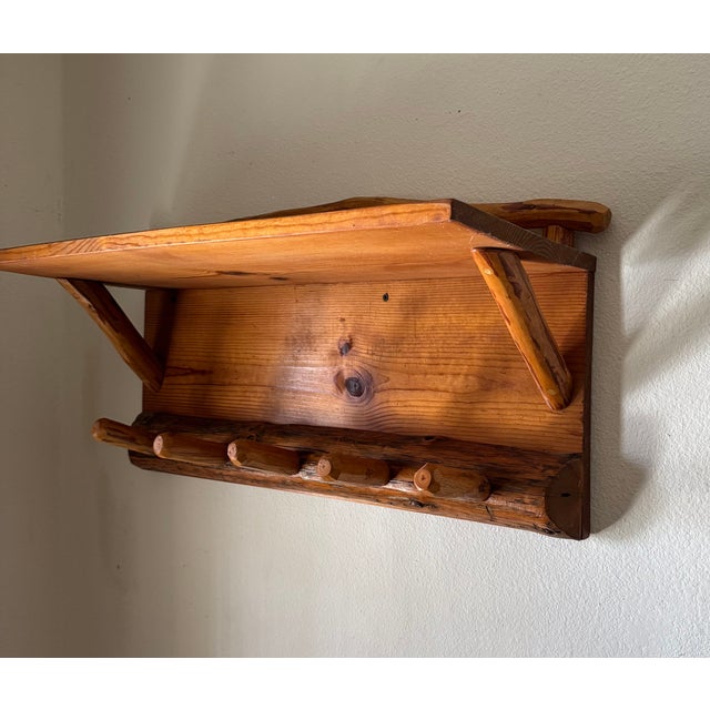 This shelf was in a guest apartment on the lakefront property we bought. Cant find any info on the brand Camp Rustix but...