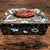A carved Chinese jade and enamel cloisonne hinged metal box featuring intricate cloisonne detailing with enamel and jade...