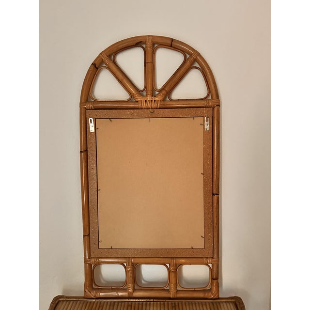 An elegant and highly regarded Italian set of arched mirror and demi-lune console, designed and produced by Vivai del Sud,...