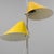 A floor lamp designed by Hans-Agne Jakobsson, Sweden, circa 1970. Yellow painted metal adjustable height shades on...