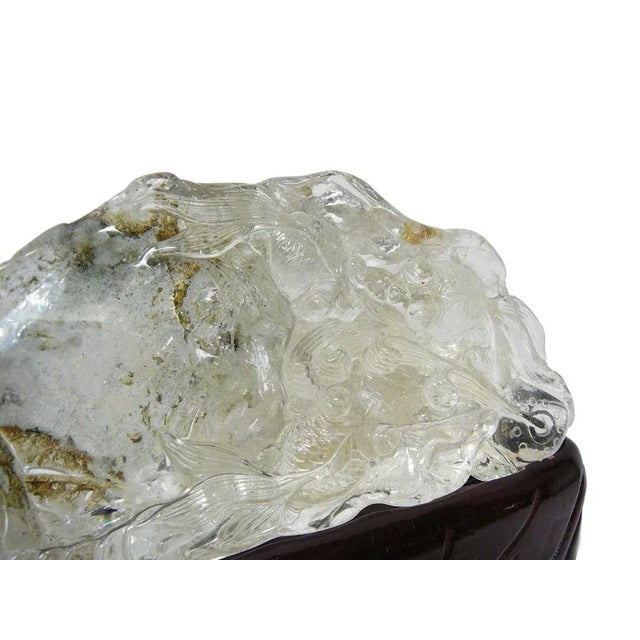 Handcrafted detail natural crystal stone with gold fish play, display on custom wood stand. Unique with character, great...