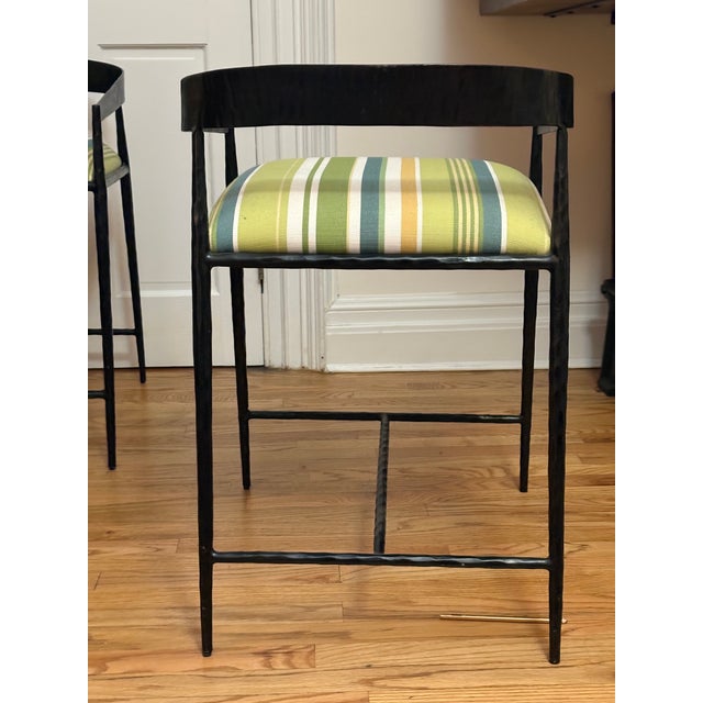 Beautifully-crafted custom iron counter-height stools with low backs and upholstered seats. Set of three.