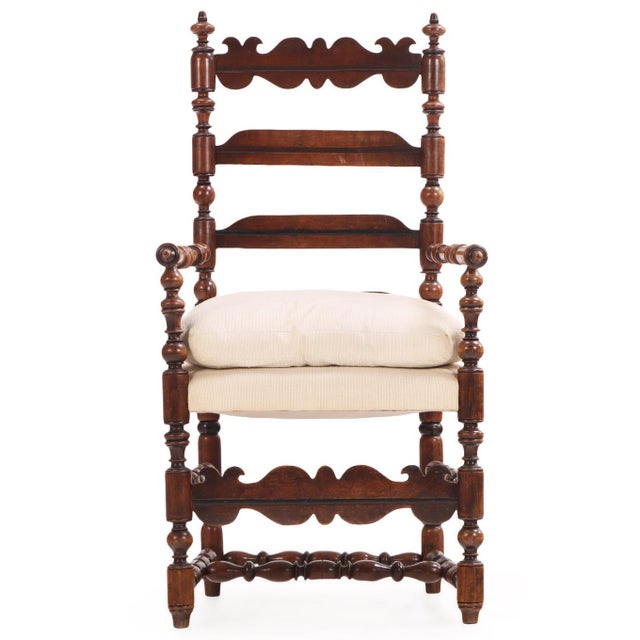 A distinctive 19th-century French Arts & Crafts turned-wood armchair featuring an impressive ladderback design with...