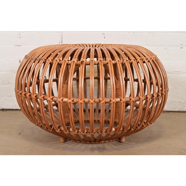 A gorgeous mid-century Organic Modern bent rattan pouf ottoman, footstool, or side table Designed by Franco Albini Italy,...