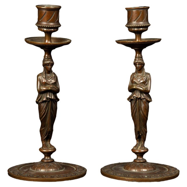 19th Century Bronze Full Body Greek Revival Caryatid Candlestick pair. These candlesticks exude timeless elegance,...