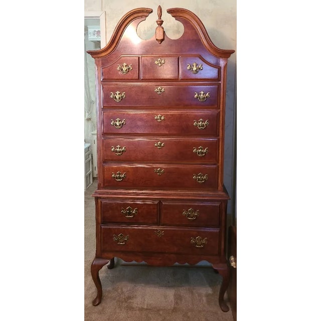 Ethan Allen traditional tall chest featuring classic American craftsmanship with a rich warm wood finish and elegant...