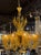 This vintage amber colored Murano glass chandelier with 12 arms. The chandelier is made of beautiful colored glass...