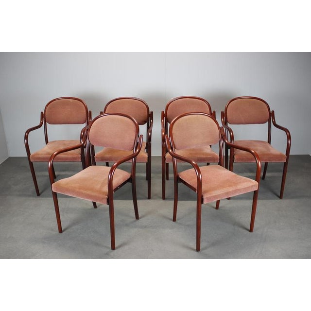 Classic bentwood armchair produced under the Thonet Vienna lineage in Austria, dated 1991. Featuring a gracefully curved...