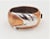 This is part of Chairish’s Costume Jewelry assortment. Hammered copper plate and rhodium plate wide cuff bracelet with box...