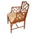 A single vintage armchair features a Chinese Chippendale bamboo style frame with a warm, medium-brown finish. The back...