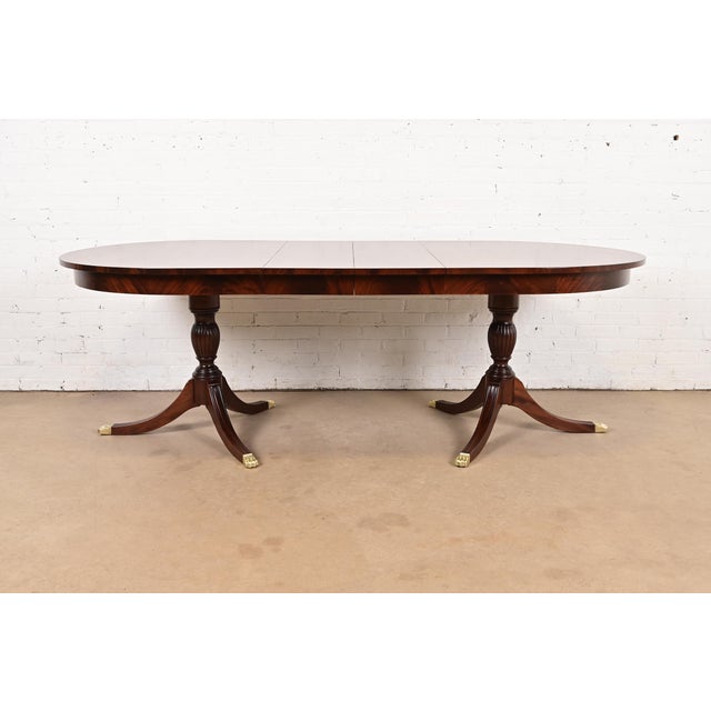 An exceptional Georgian or Regency style double pedestal extension dining table By Henkel Harris USA, Circa 1980s Gorgeous...