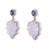 Elegant and sculptural, these carved chalcedony drop earrings showcase a harmonious blend of colour, texture and...