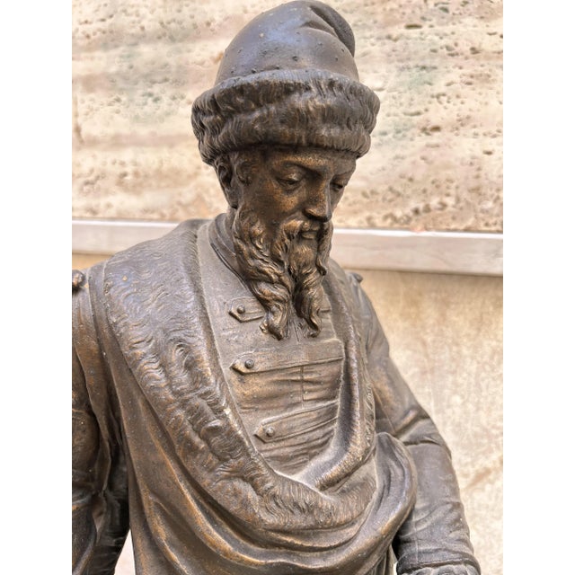 Bronze from the early 1900s This could be a statue of a man in Renaissance clothing, perhaps a merchant or a scholar,...