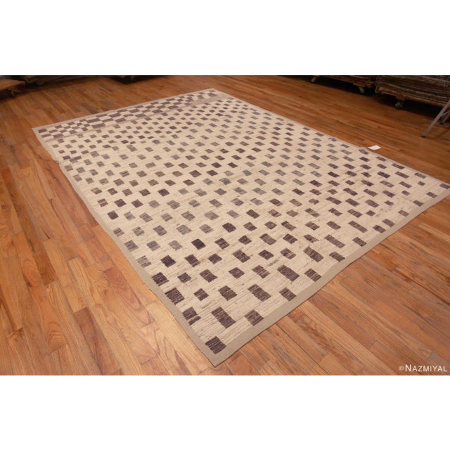 A Beautiful And Decorative Ivory Cream Background With Light Brown Color Tribal Geometric Checkerboard Pattern Modern Room...