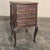 A refined 19th century French walnut petit commode fashioned in the graceful Louis XV tradition. Its beautifully carved...