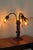 This art nouveau lamp is made of cast metal that does not attract a magnet. The body features three cherubs, one for each...