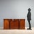 English mahogany sideboard dating from the mid-19th century, featuring an elegant and functional design. The front...