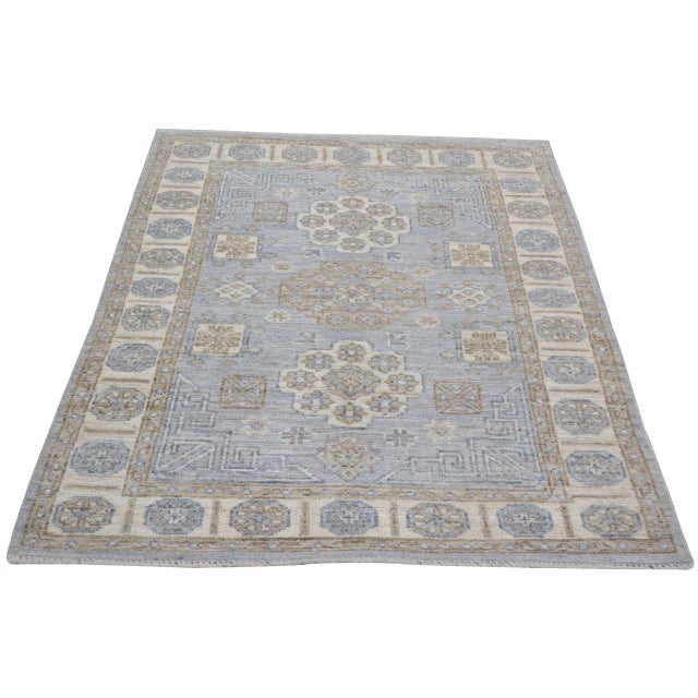 A hand-knotted Turkish Oushak rug featuring soft, time-worn tones and signature large-scale motifs that bring effortless...