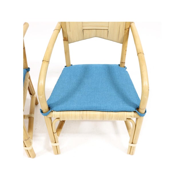 For Donghia, cane wrapped back and seat, bentwood rattan frame, custom blue seat cushions, marked. 36 x 22 x 21 in. From...