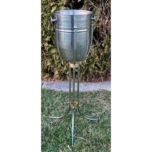 Vintage (1970's) Steel & Bronze Champagne Ice Bucket with Stand has an Art Deco Style. The Measurements: 15"W x 12"D x...