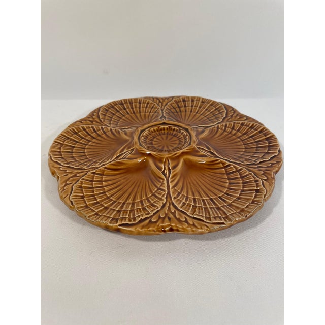 A stunning deep gold/amber French Majolica Sarreguemines Oyster Plate, circa 1920s-30s. Signed Sarreguemines on the back...