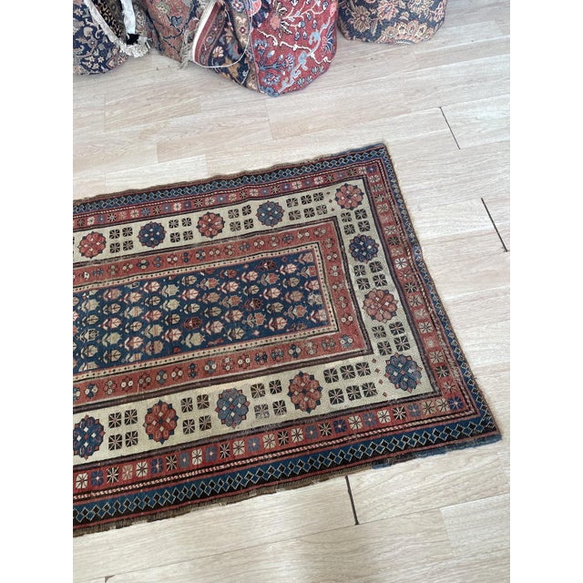 An authentic and highly collectible antique hand-knotted Caucasian rug, woven circa 1880s in the Talish region of the...