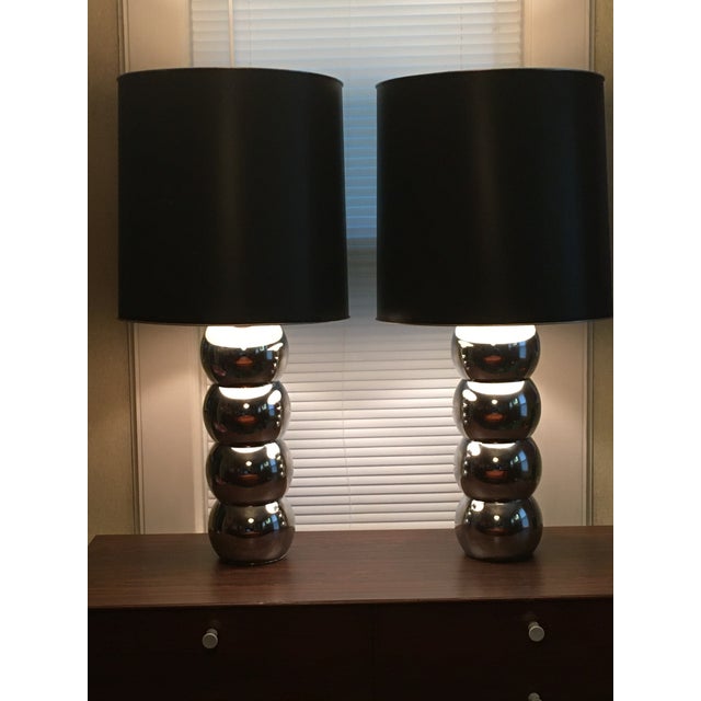 Iconic pair of chrome 4 stacked balls table lamps by George Kovacs made in the 1970’s. They come with their original black...