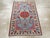 A vintage East Turkestan Khotan throw rug handmade during the Mid-20th Century. Measures: 2' 7" x 3' 10".