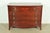 A gorgeous Federal or Hepplewhite style bow front four-drawer dresser or chest of drawers By National Furniture Co. of...