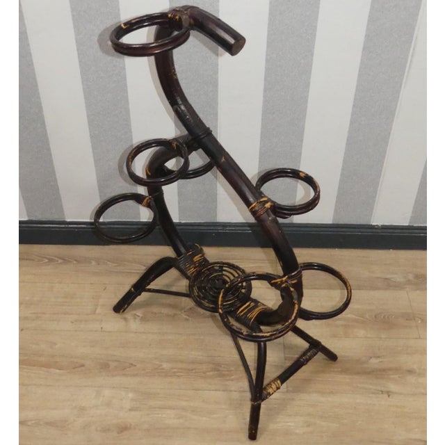 Great side decoration! Very cool, huge plant stand with eight spaces Classic made of bamboo wood/rattan painted black...