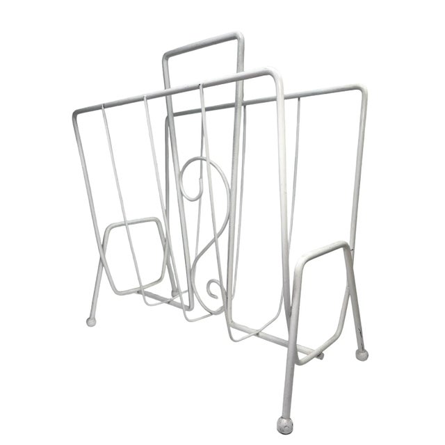 Add a vintage touch to your room with this fabulous atomic mid-century metal magazine rack from the 1950s. Nice sturdy...