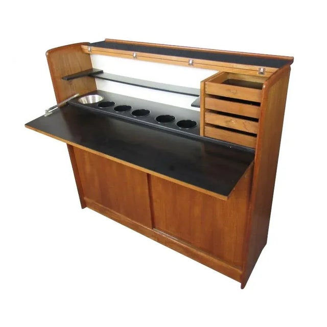 This stunning Danish dry bar is sure to be the life of the party! The gorgeous teak wood grain guarantees that this piece...