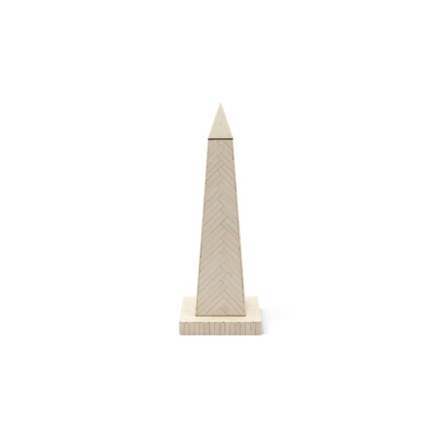 Two decorative obelisks, circa 1970. The taller is clad in bone inlay laid in a crisp herringbone pattern and stands on a...